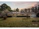 Charming single-story home with a spacious front yard, mature trees, and welcoming curb appeal at 468 Wilhelm Ne Pl, Concord, NC 28025