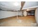 Unfinished basement space shows utility hookups and storage platform at 4824 Harcourt Ln, Charlotte, NC 28212