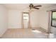 This is a bright bedroom with neutral walls and carpet at 4824 Harcourt Ln, Charlotte, NC 28212