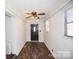 This home's entryway features wood look floors and painted paneled walls at 4824 Harcourt Ln, Charlotte, NC 28212