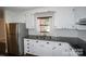 Modern kitchen featuring stainless steel appliances, granite countertops and white cabinets at 4824 Harcourt Ln, Charlotte, NC 28212
