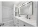 Modern bathroom with a dual sink vanity, bathtub, and shower combination at 5015 Forestmont Dr, Matthews, NC 28105
