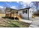 Exterior corner view showing the well-constructed deck and a concrete driveway at 5015 Forestmont Dr, Matthews, NC 28105