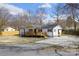 Charming single-story home boasts a well-manicured lawn and a spacious concrete driveway at 5015 Forestmont Dr, Matthews, NC 28105