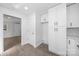 Bright kitchen space with all white cabinets, updated appliances, and vinyl flooring at 5015 Forestmont Dr, Matthews, NC 28105