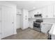 Kitchen featuring white cabinets, subway tile backsplash, and stainless steel appliances at 5015 Forestmont Dr, Matthews, NC 28105