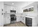 Well-lit kitchen featuring white cabinets, modern appliances, and sleek countertops at 5015 Forestmont Dr, Matthews, NC 28105