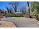 Backyard with privacy fence, shed, storage shed, and gravel seating area at 5230 Northview Dr, Hickory, NC 28601