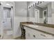 Bathroom features a white vanity with grey walls, white trim and a walk in shower at 5230 Northview Dr, Hickory, NC 28601
