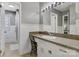 Bathroom with white cabinetry, tile, a large mirror, and shower at 5230 Northview Dr, Hickory, NC 28601