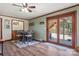 Dining room with hardwood floors, green walls, and a wood-framed glass door to the outside at 5230 Northview Dr, Hickory, NC 28601