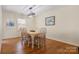 Bright dining room featuring hardwood floors and a rustic dining set, ideal for Gathering meals at 5230 Northview Dr, Hickory, NC 28601