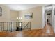 Open hallway area with hardwood floors, chandelier, and a glimpse of the front door at 5230 Northview Dr, Hickory, NC 28601