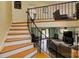 Open floor plan with living room and staircase featuring hardwood floors and cozy furnishings at 5230 Northview Dr, Hickory, NC 28601