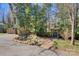 Landscaped backyard with pond, gazebo, shed, and brick walkway at 5230 Northview Dr, Hickory, NC 28601