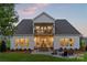 Spacious backyard featuring a stone patio with a fire pit and outdoor seating at 5312 Allburn Pkwy, Concord, NC 28027