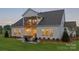 Spacious backyard featuring a stone patio with a fire pit and outdoor seating at 5312 Allburn Pkwy, Concord, NC 28027