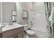 Well-lit bathroom with vanity, quartz countertop, framed mirror, and shower-tub combo at 5312 Allburn Pkwy, Concord, NC 28027