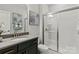 Bathroom features a tiled shower with glass doors, neutral paint, and a modern vanity at 5312 Allburn Pkwy, Concord, NC 28027