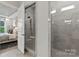 Luxurious bathroom with a tiled glass-door shower and a view into the bedroom at 5312 Allburn Pkwy, Concord, NC 28027