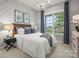 Comfortable bedroom with a plush bed, stylish wallpaper, and large window at 5312 Allburn Pkwy, Concord, NC 28027