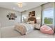 Comfortable bedroom with natural light, gray walls, and stylish decor at 5312 Allburn Pkwy, Concord, NC 28027