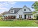 Charming two-story home with well-manicured lawn and inviting front porch at 5312 Allburn Pkwy, Concord, NC 28027