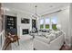 Inviting living room with fireplace, custom built-ins, and ample natural light at 5312 Allburn Pkwy, Concord, NC 28027