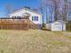 Features an expansive wooden deck and a convenient detached garage in a well-maintained backyard at 5985 Bertie Ave, Salisbury, NC 28147