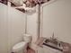 Functional basement features a utility sink and toilet, offering practicality and convenience at 5985 Bertie Ave, Salisbury, NC 28147