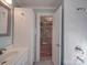 Bright bathroom with an open shower and plenty of storage space in white cabinets at 5985 Bertie Ave, Salisbury, NC 28147