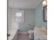 Bathroom featuring a shower-tub combo and neutral color palette at 5985 Bertie Ave, Salisbury, NC 28147