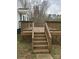 Spacious wooden deck featuring stairs and wooden railings at 5985 Bertie Ave, Salisbury, NC 28147