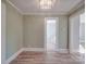 Hallway showcasing refinished hardwood floors and freshly painted walls at 5985 Bertie Ave, Salisbury, NC 28147