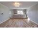A bright kitchen with ample storage, hardwood floors, and natural light from windows at 5985 Bertie Ave, Salisbury, NC 28147