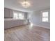 Bright kitchen with painted gray cabinetry, hardwood floors, and ample natural light at 5985 Bertie Ave, Salisbury, NC 28147