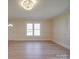 Bright living room with hardwood floors and natural light streaming through the windows at 5985 Bertie Ave, Salisbury, NC 28147
