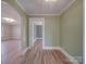 Inviting living room with hardwood floors and an arched doorway to a neighboring room at 5985 Bertie Ave, Salisbury, NC 28147