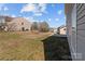 Large backyard with grass and trees, offering plenty of space for outdoor activities at 603 Smokehouse Ln, Albemarle, NC 28001