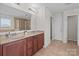 Bright bathroom features double sink vanity, large mirror, and separate shower at 603 Smokehouse Ln, Albemarle, NC 28001