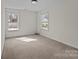 Bedroom with neutral carpet flooring and plenty of natural light at 603 Smokehouse Ln, Albemarle, NC 28001