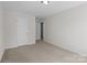 Bedroom features neutral carpet and white walls at 603 Smokehouse Ln, Albemarle, NC 28001