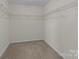 Walk-in closet with carpet flooring and wire shelving at 603 Smokehouse Ln, Albemarle, NC 28001