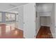 Bright entryway showcasing hardwood floors, fresh white walls, and a closet for added storage at 603 Smokehouse Ln, Albemarle, NC 28001