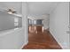 Inviting entryway features hardwood floors, neutral paint, and views into the home's open layout at 603 Smokehouse Ln, Albemarle, NC 28001