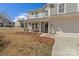 Two-story home with covered front porch, attached garage, and landscaped front yard at 603 Smokehouse Ln, Albemarle, NC 28001