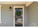 Close-up of front door with glass panel and decorative wreath, enhancing curb appeal at 603 Smokehouse Ln, Albemarle, NC 28001