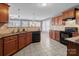 Well-lit kitchen featuring granite countertops, tile backsplash, stainless steel appliances and view into the breakfast nook at 603 Smokehouse Ln, Albemarle, NC 28001