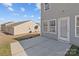 Concrete patio area perfect for grilling and entertaining, accessible through a glass door at 603 Smokehouse Ln, Albemarle, NC 28001