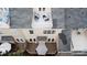 This aerial view reveals a home featuring an upper balcony and a ground-level deck, perfect for outdoor enjoyment at 609 Sunfish Ln, Tega Cay, SC 29708